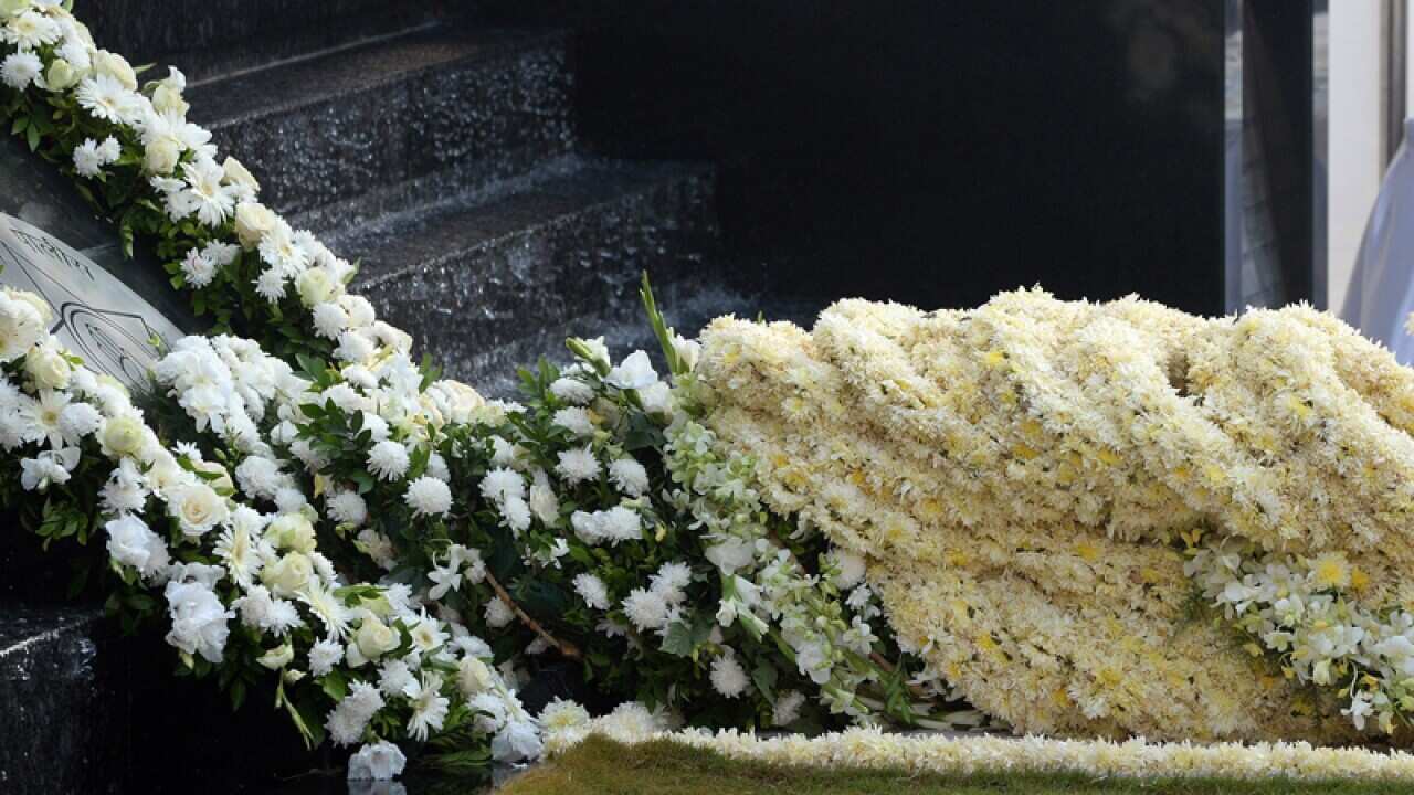 Visitors offer wreaths at the memorial for the 2008 terror attacks