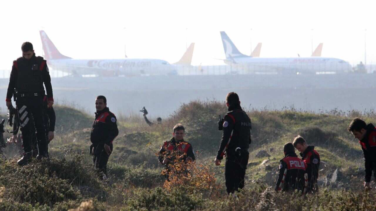 Turkish police search the area around Sabiha Gokcen Airport.
