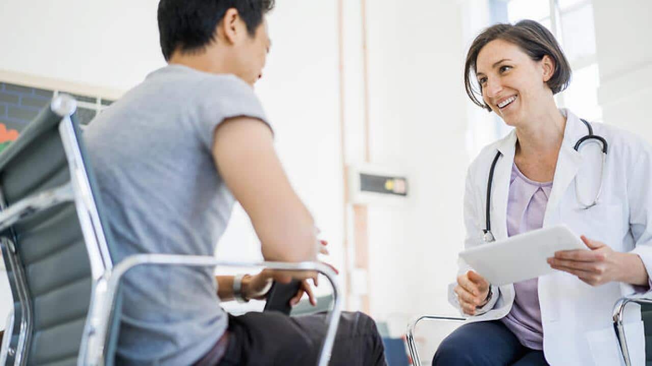 Doctor with patient in hospital