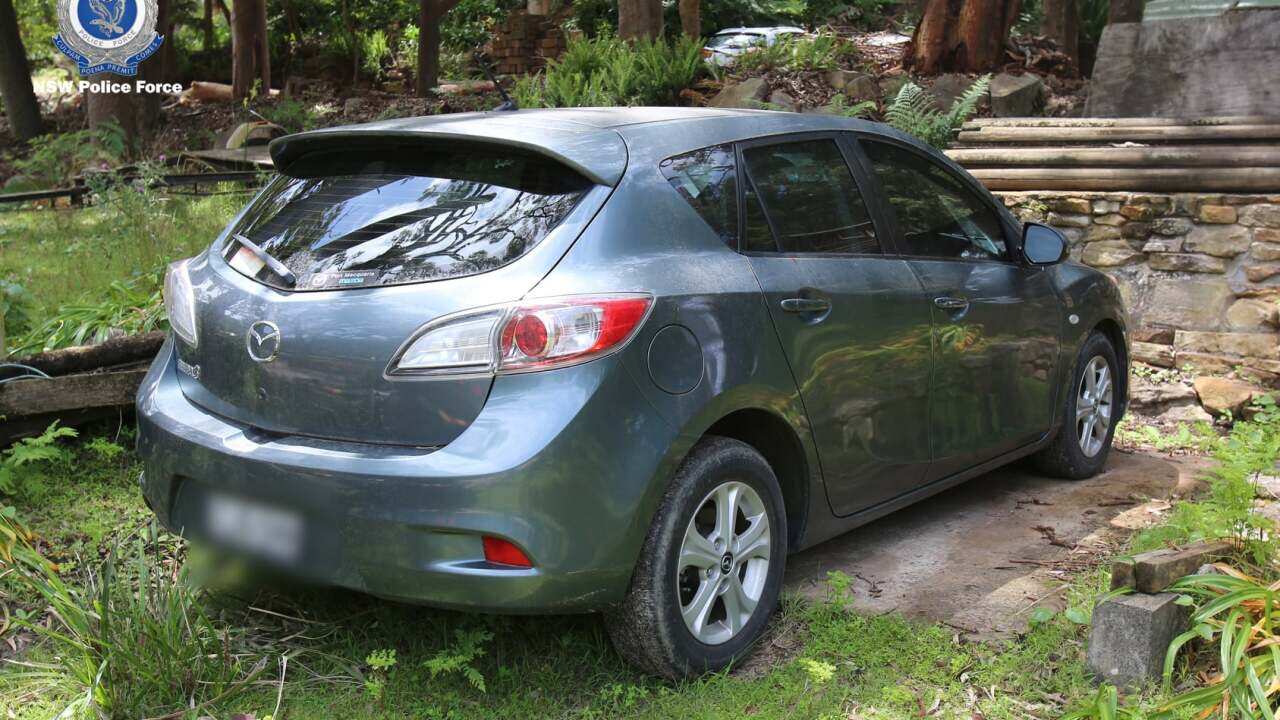 Grey Mazda seized by police.