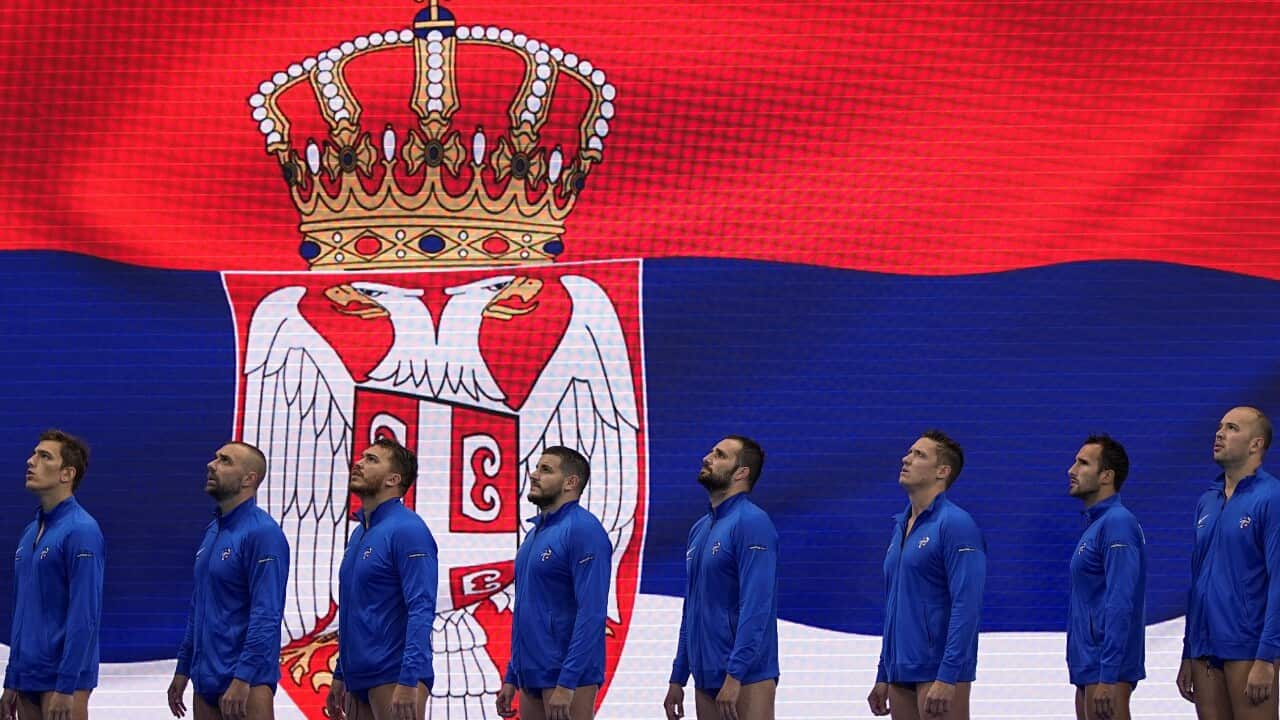 Members of Team Serbia sing the national anthem before the start of the the Men Water Polo quarter-finals match between Serbia and USA at the World Aquatics Championships Singapore 2025 in Singapore