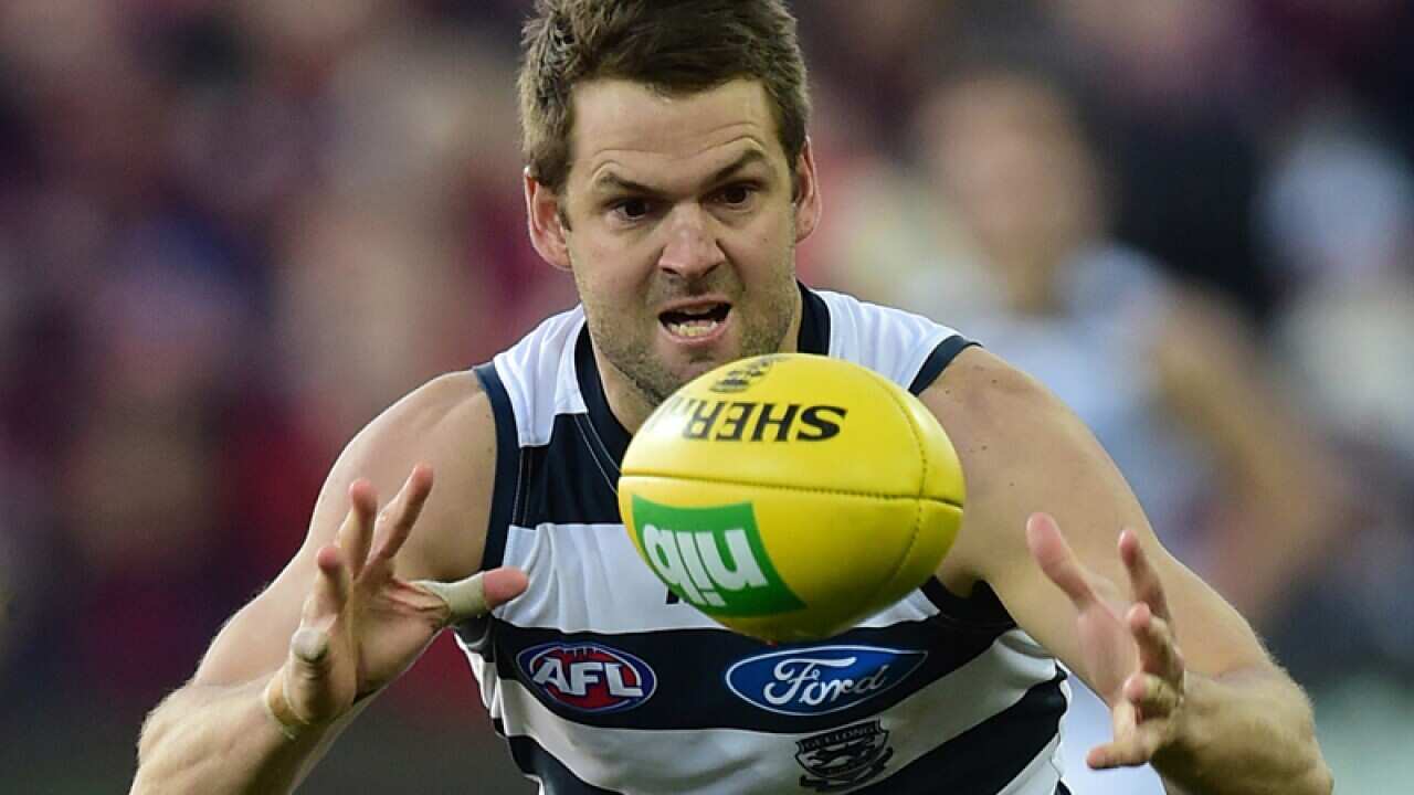 Geelong Cats player Jared Rivers (right)