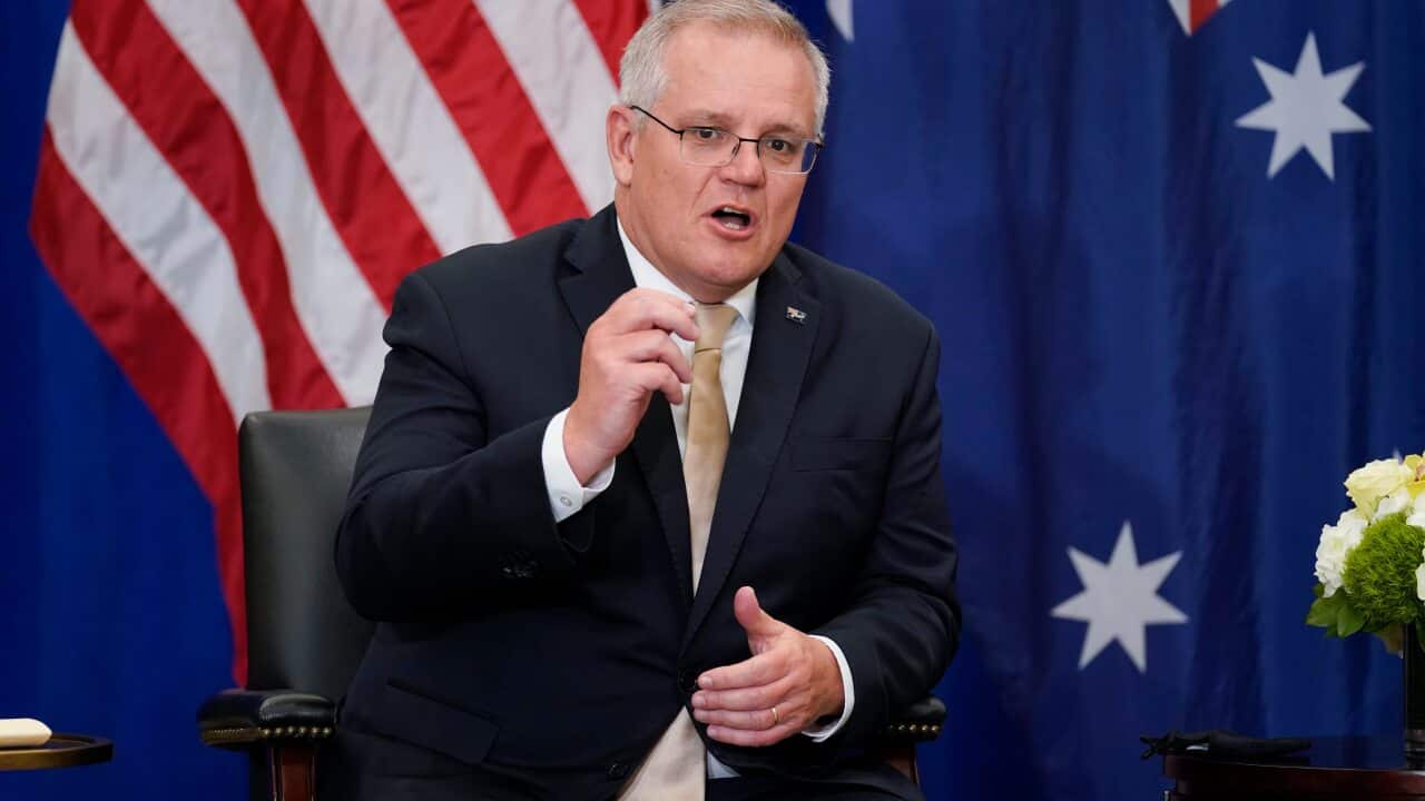 Australian Prime Minister Scott Morrison speaks as he meets with US President Joe Biden