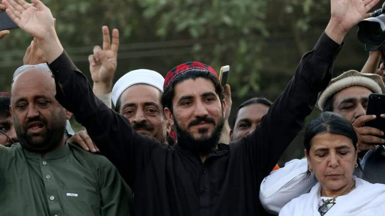 Manzoor Pashteen (C), leader of Pashtun Tahafuz Movement (PTM) waves to supporters during a gathering in Lahore, Pakistan, 22 April 2018 (issued 23 April).