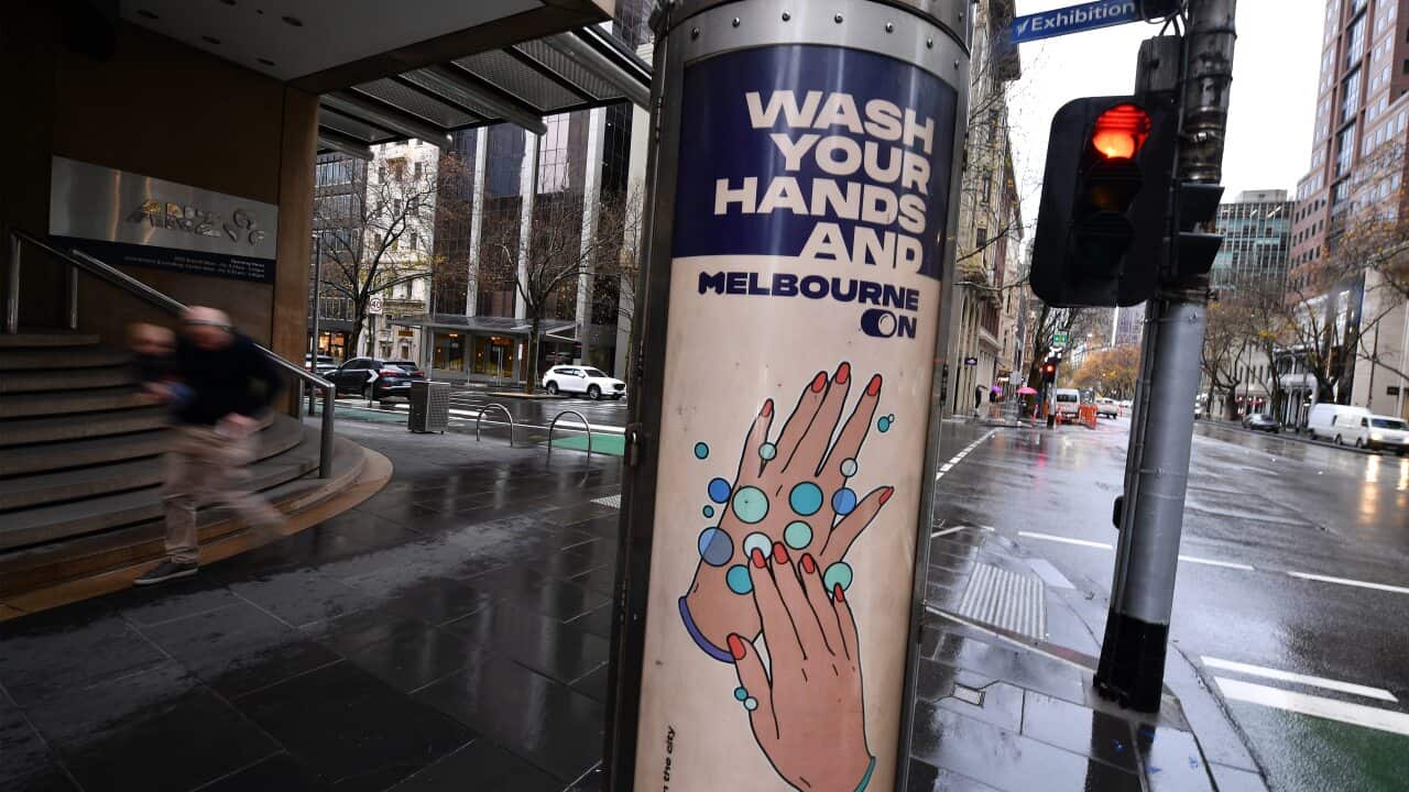 Signage promoting hand sanitisation is seen in Melbourne.