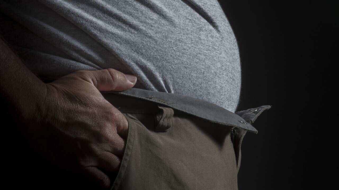 A man with a large waistline