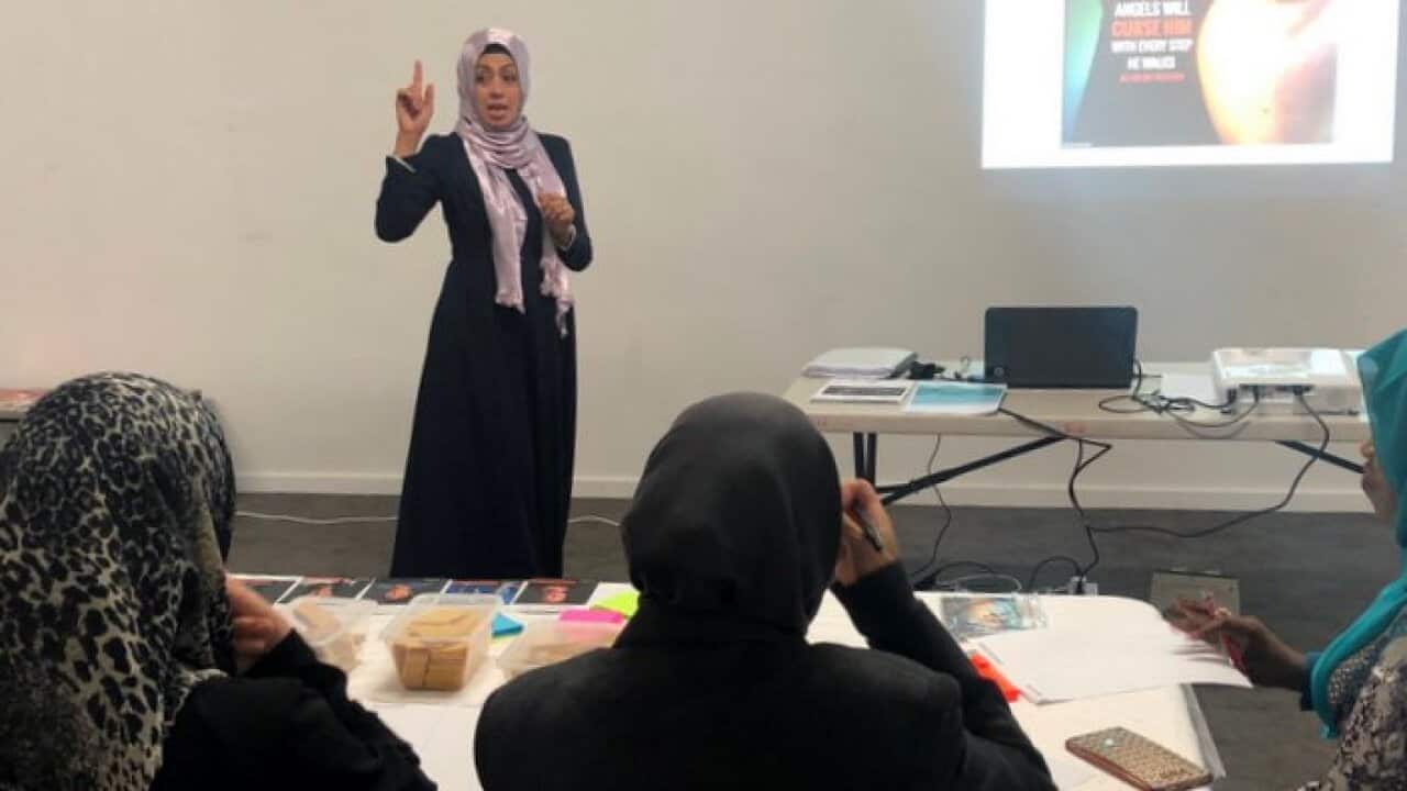 Manal Shehab delivering presentation on domestic violence (SBS)