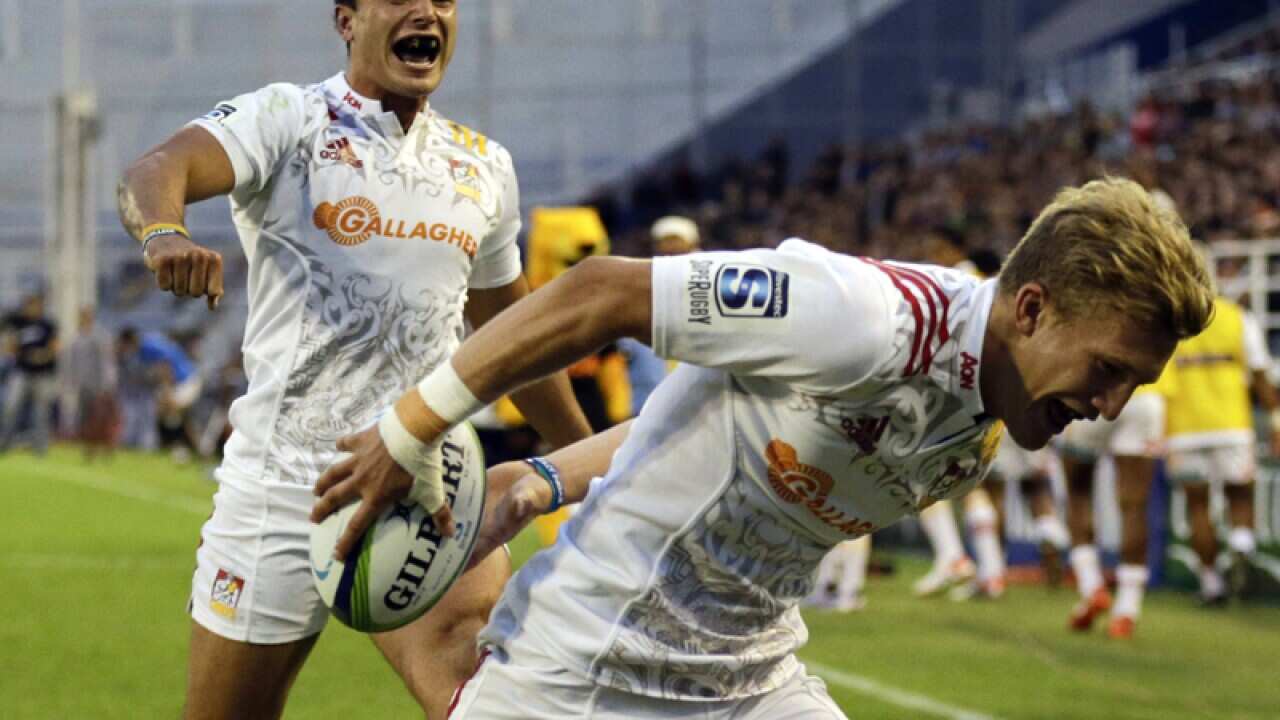 Chiefs' James Lowe, left, cheers on teammate Damian McKenzie