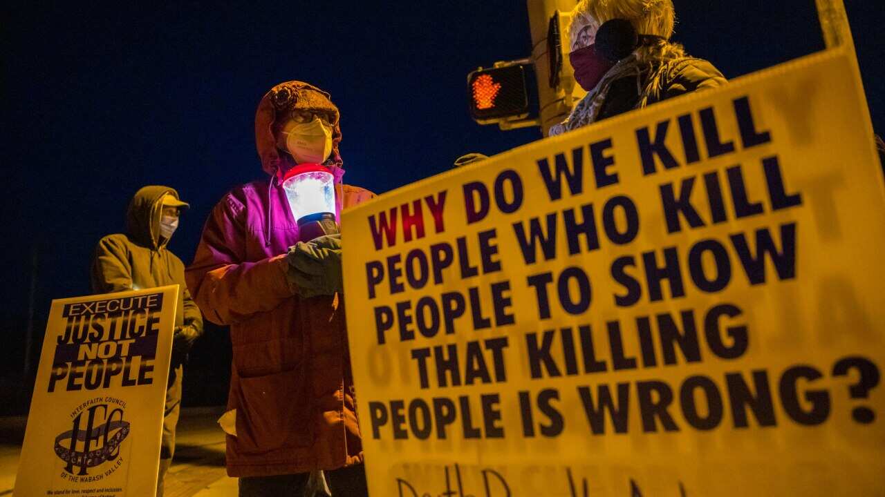 Protesters in Bloomington, Indiana, rally against executions at Terre Haute Federal Prison on 12 January.