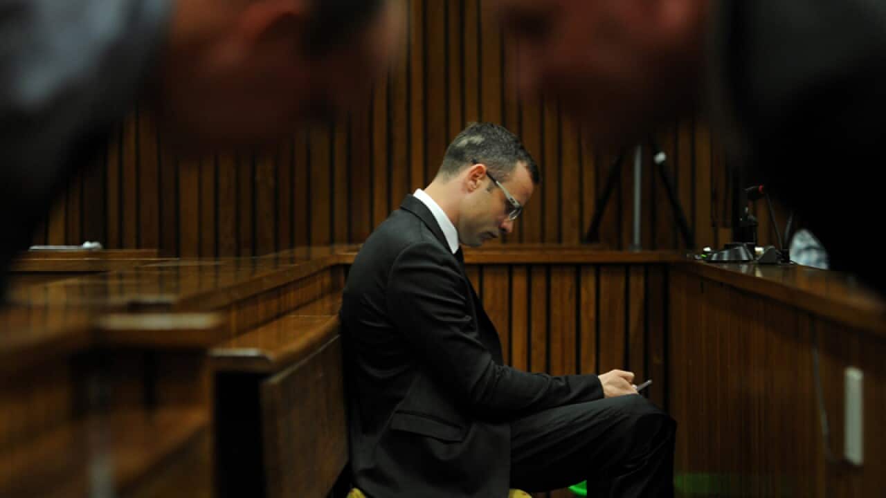 Oscar Pistorius sits in the dock inside court in Pretoria