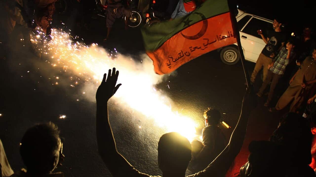 Supporters of Imran Khan, head of Pakistan Tehreek-e-Insaf (PTI) party celebrate in Hyderabadi.