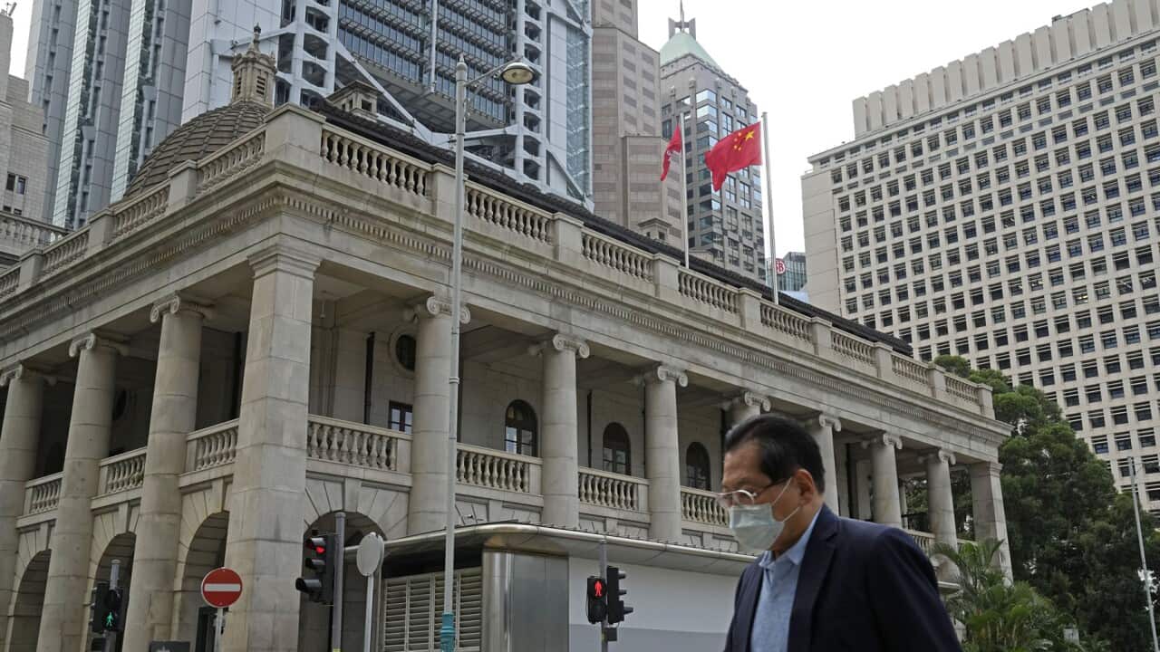 A man strolls past the Court of Appeal in Hong Kong (AAP).jpg