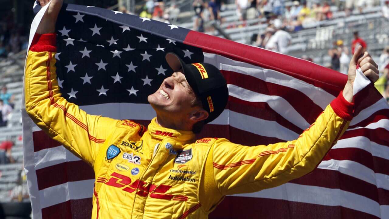 Ryan Hunter-Reay celebrates after winning the 98th Indianapolis 500