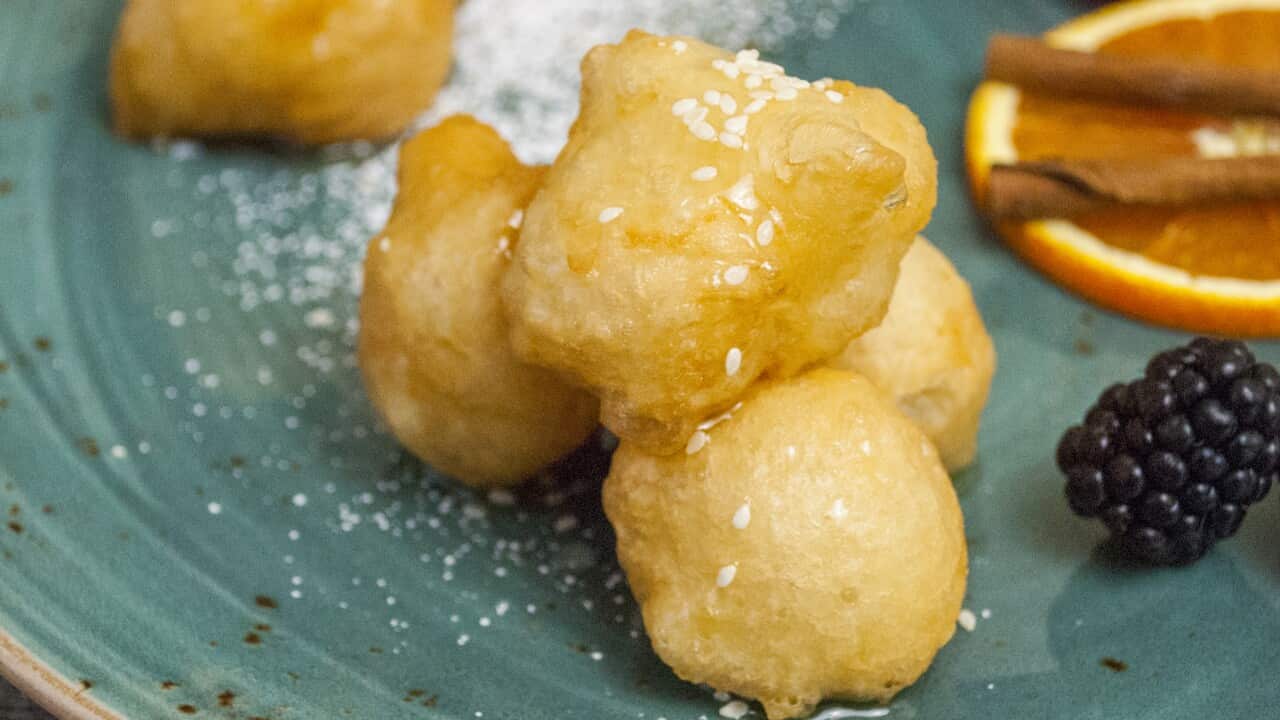 Fried dough balls in honey