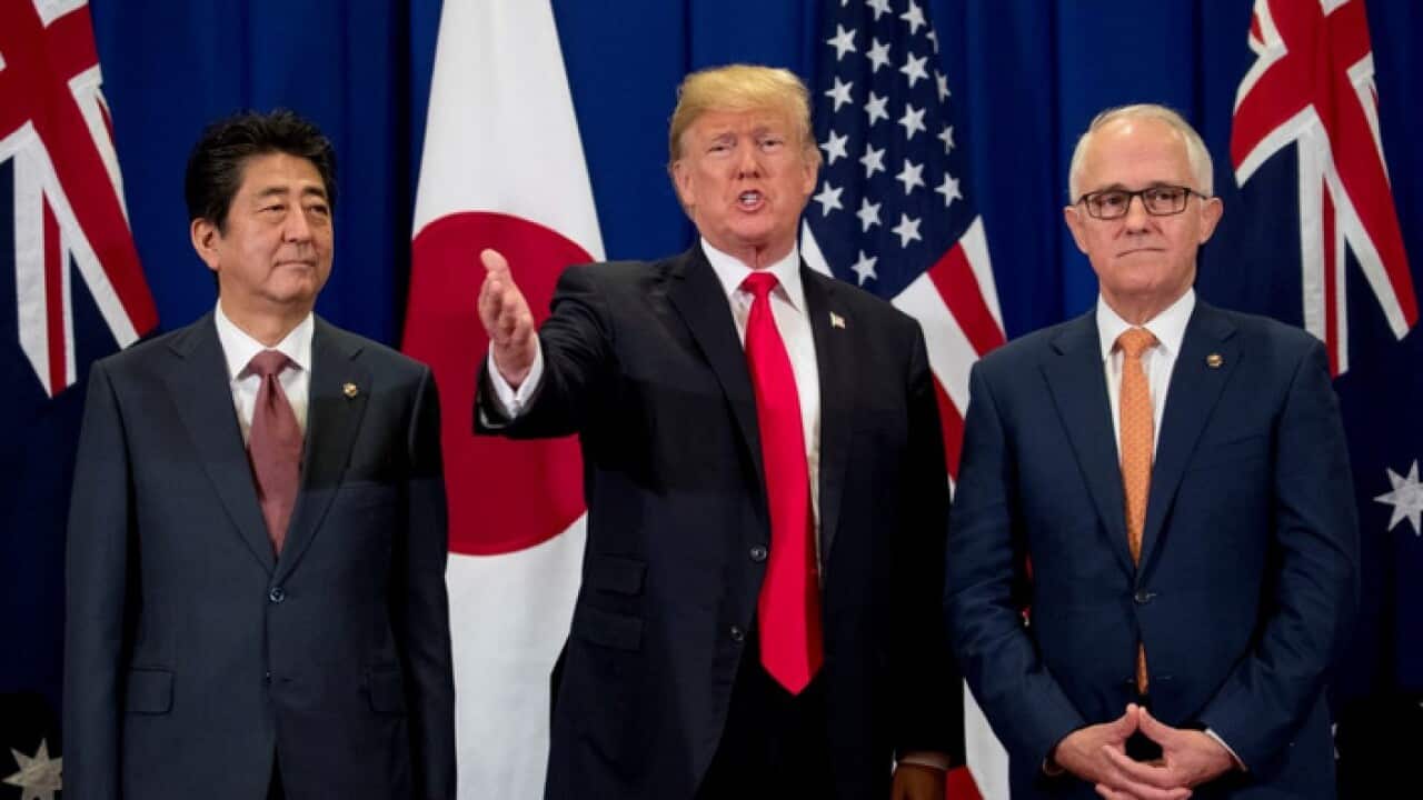 Japan’s Prime Minister Shinzo Abe, left, US President Donald Trump and Prime Minister Malcolm Turnbull attend a trilateral meeting at ASEAN.