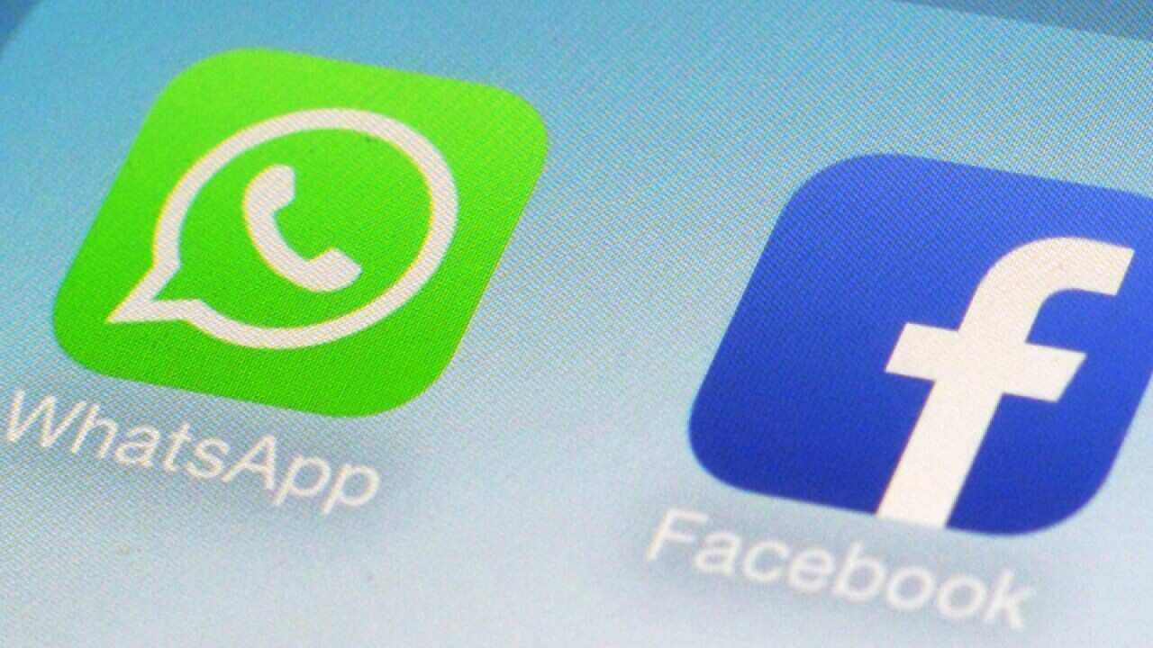 The WhatsApp and Facebook app icons on an iPhone