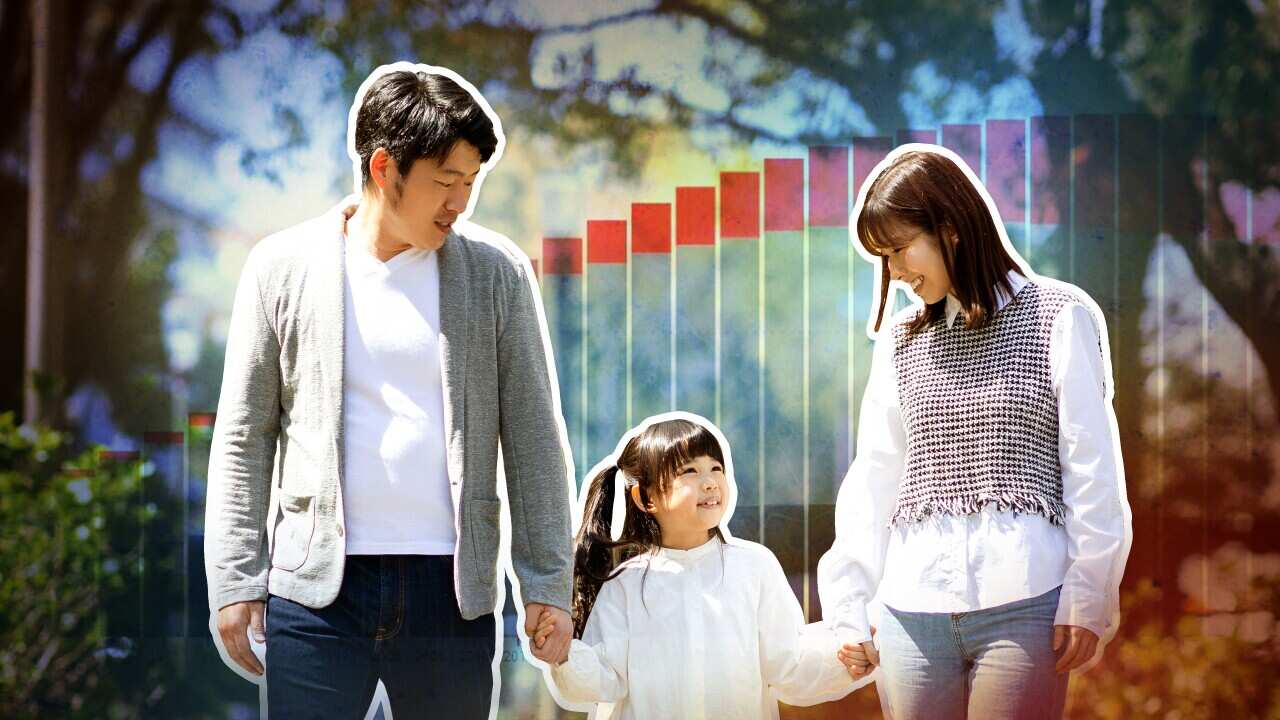 An image of parents and a child with the backdrop of a graph