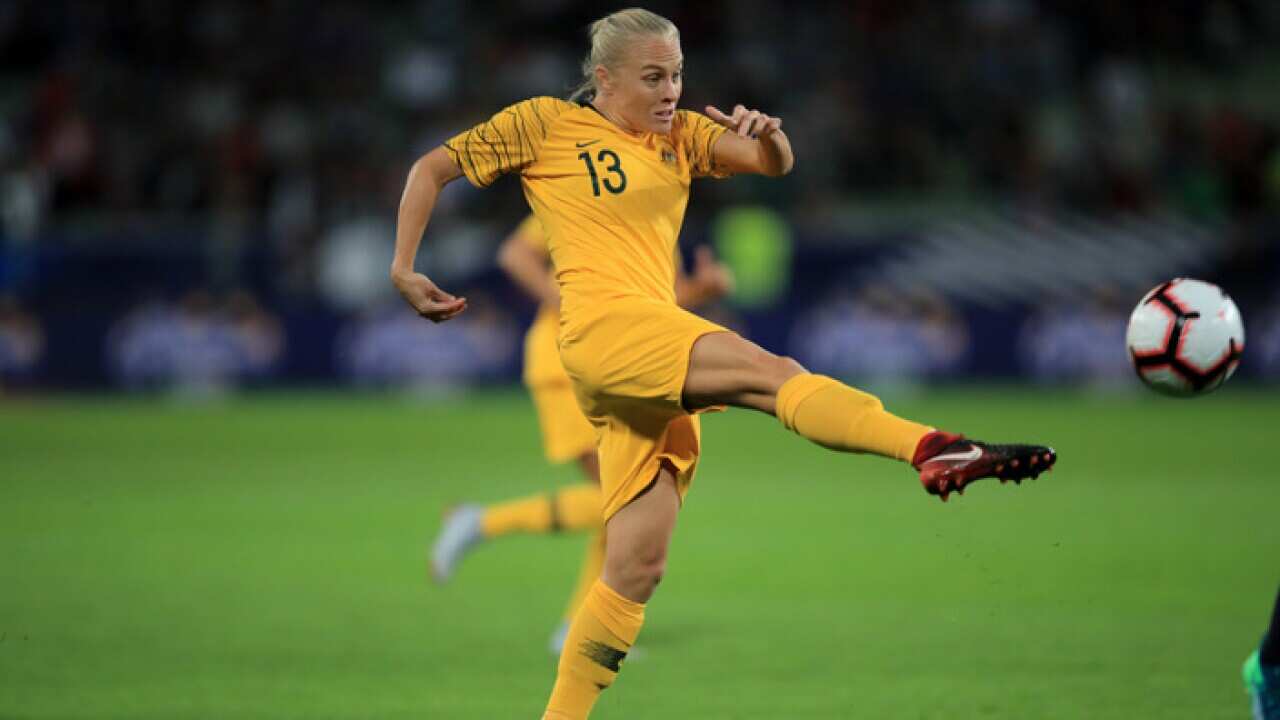Tameka Butt of Australia shoots during the friendly match against France (Getty Images)