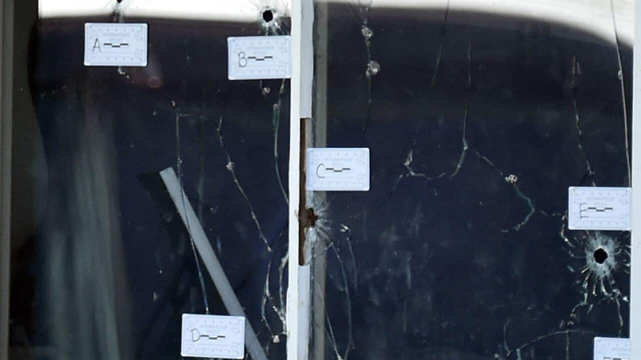 Forensic police at the scene of a fatal shooting in Thomastown