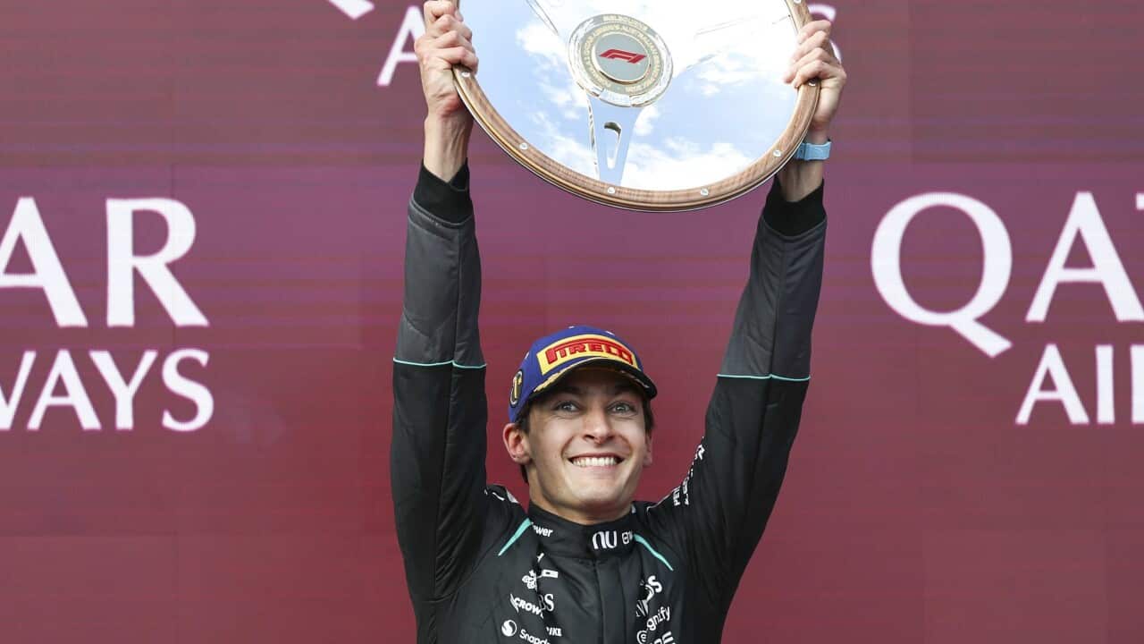 MELBOURNE, AUSTRALIA - MARCH 8: George Russell of Great Britain of Mercedes AMG PETRONAS F1 Team celebrates with race trophy after winning the F1 Grand Prix of Australia at Albert Park Circuit on March 8, 2026 in Melbourne, Australia.