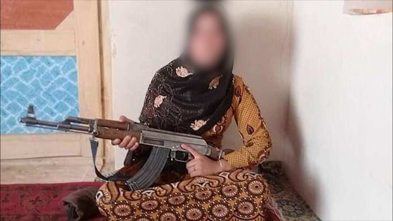 A photograph of Ms Gul, wearing a headscarf and holding a machinegun across her lap has gone viral in the past few days.