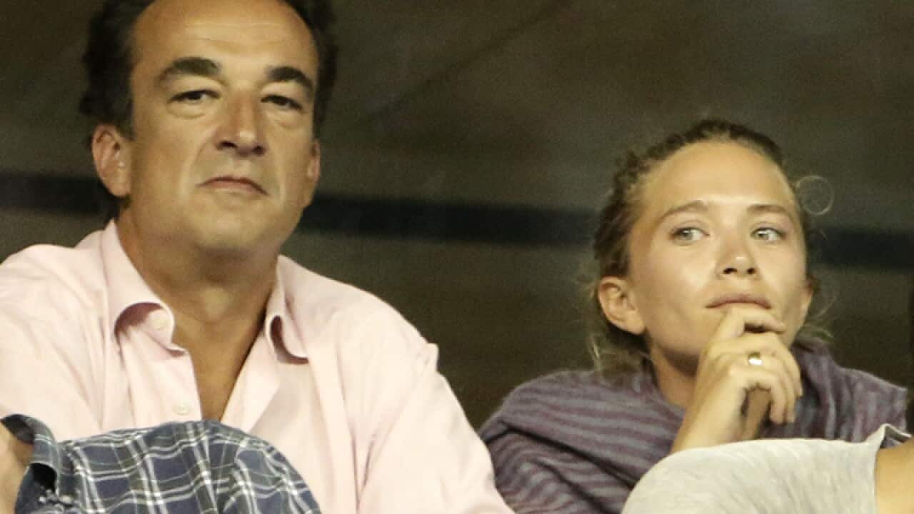 French banker Olivier Sarkozy (L) and Mary-Kate Olsen