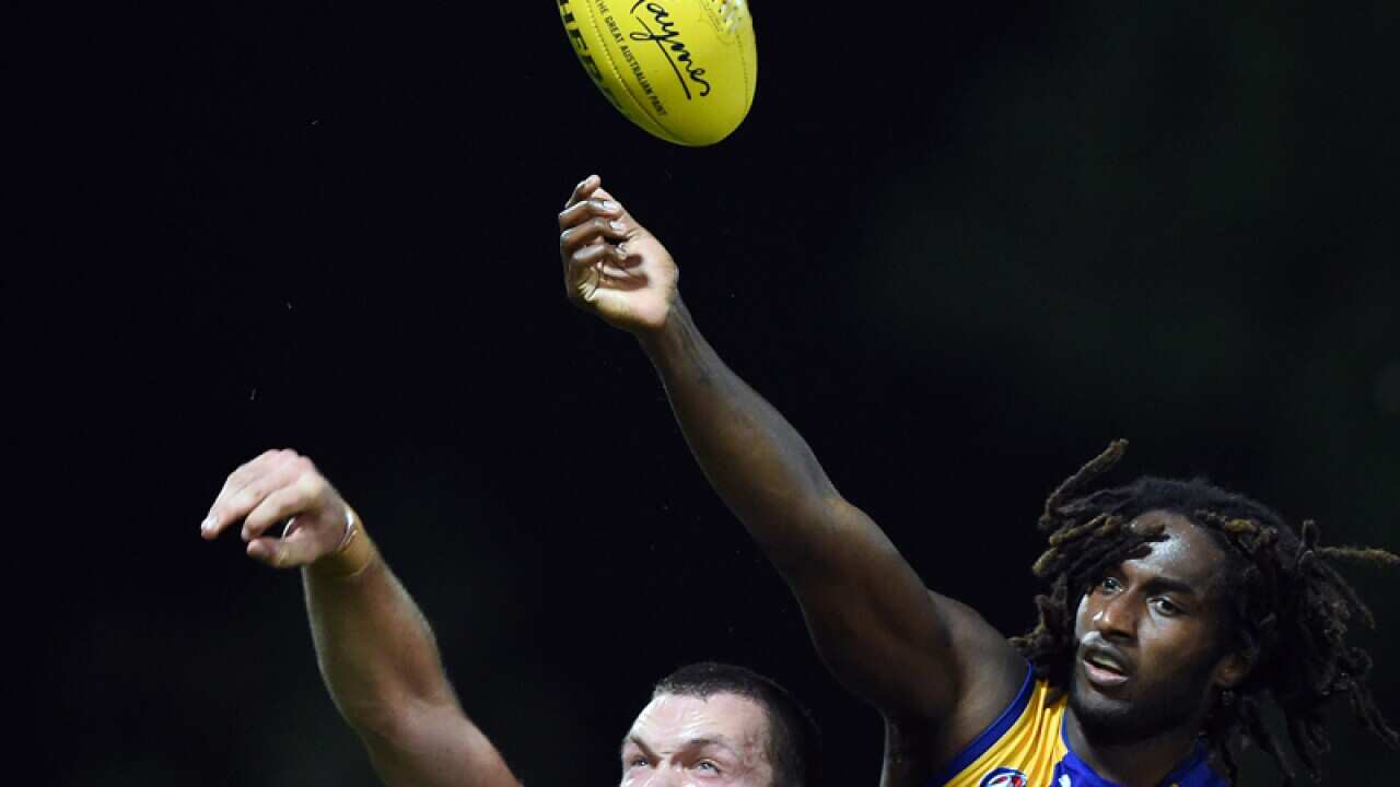 Max Gawn (L) of the Demons competes for the ball with Nic Naitanui