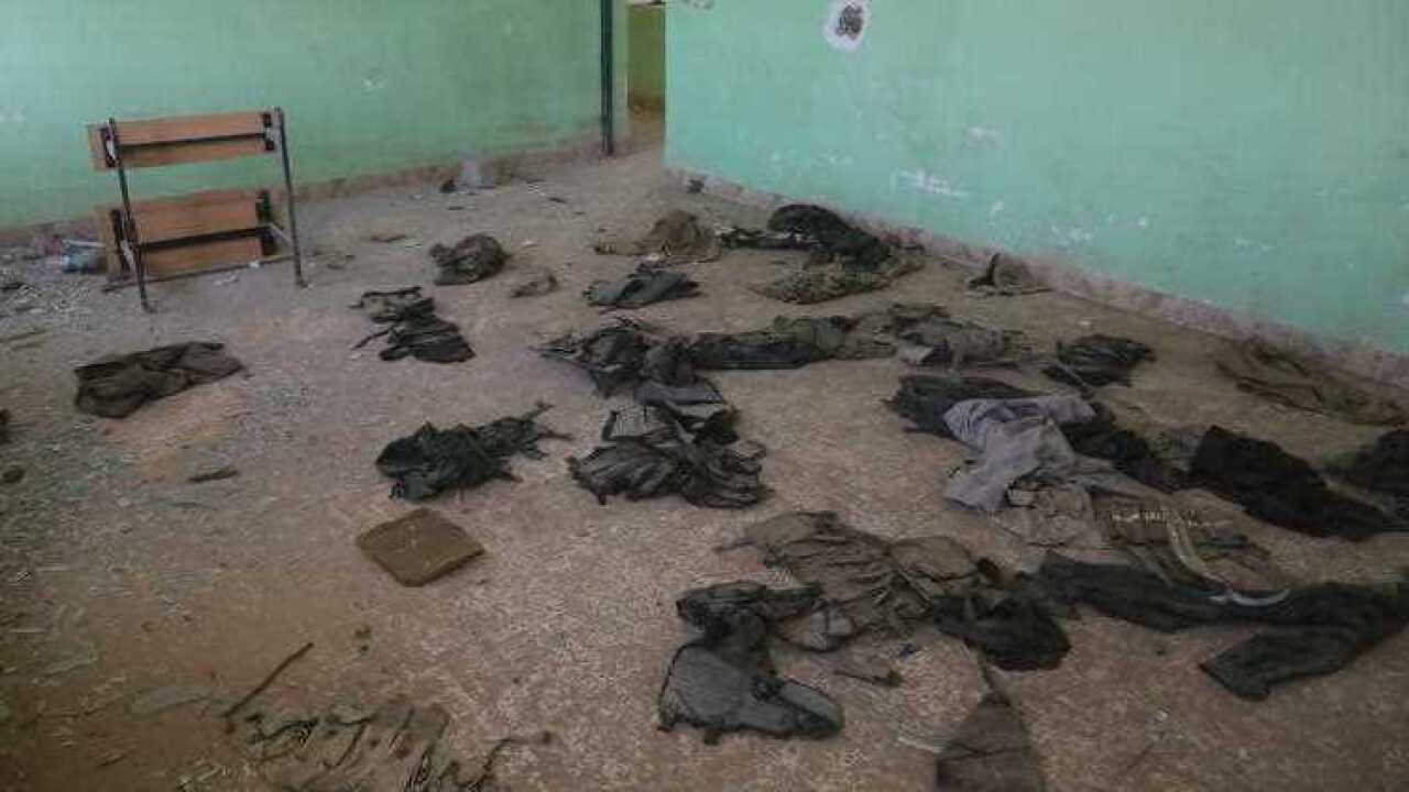 clothes laid on the ground of a classroom inside a school in the village of Kocho , south of the Yazidi hub of Sinjar in northern Iraq