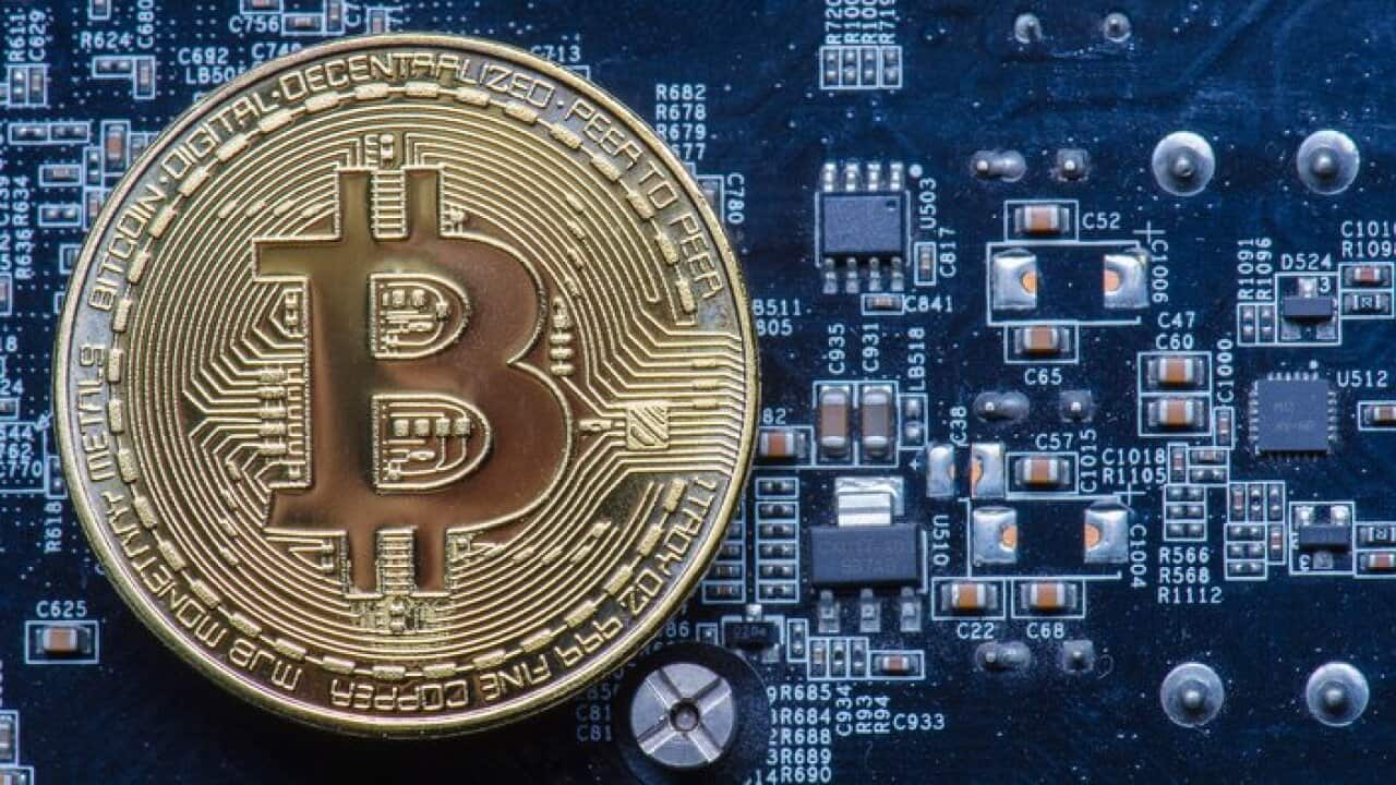 Close-Up View Of Bitcoin On Mother Board