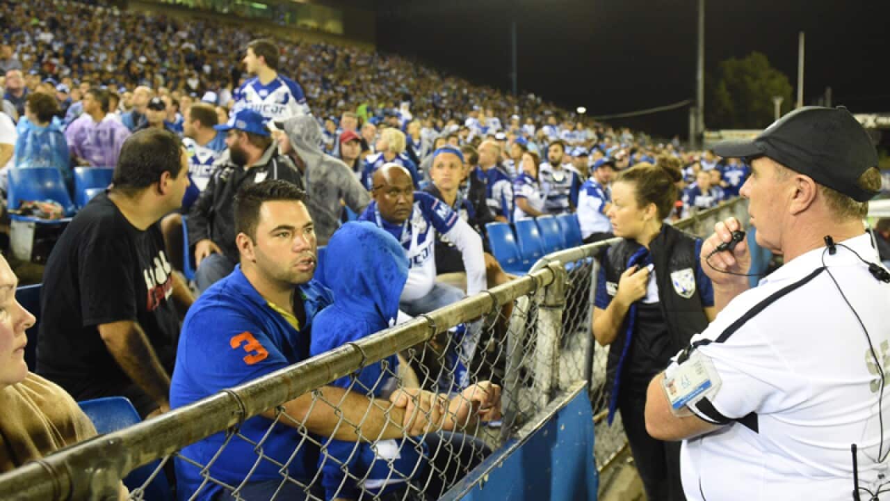 Security watch a section where a bottle was thrown at Canberra players