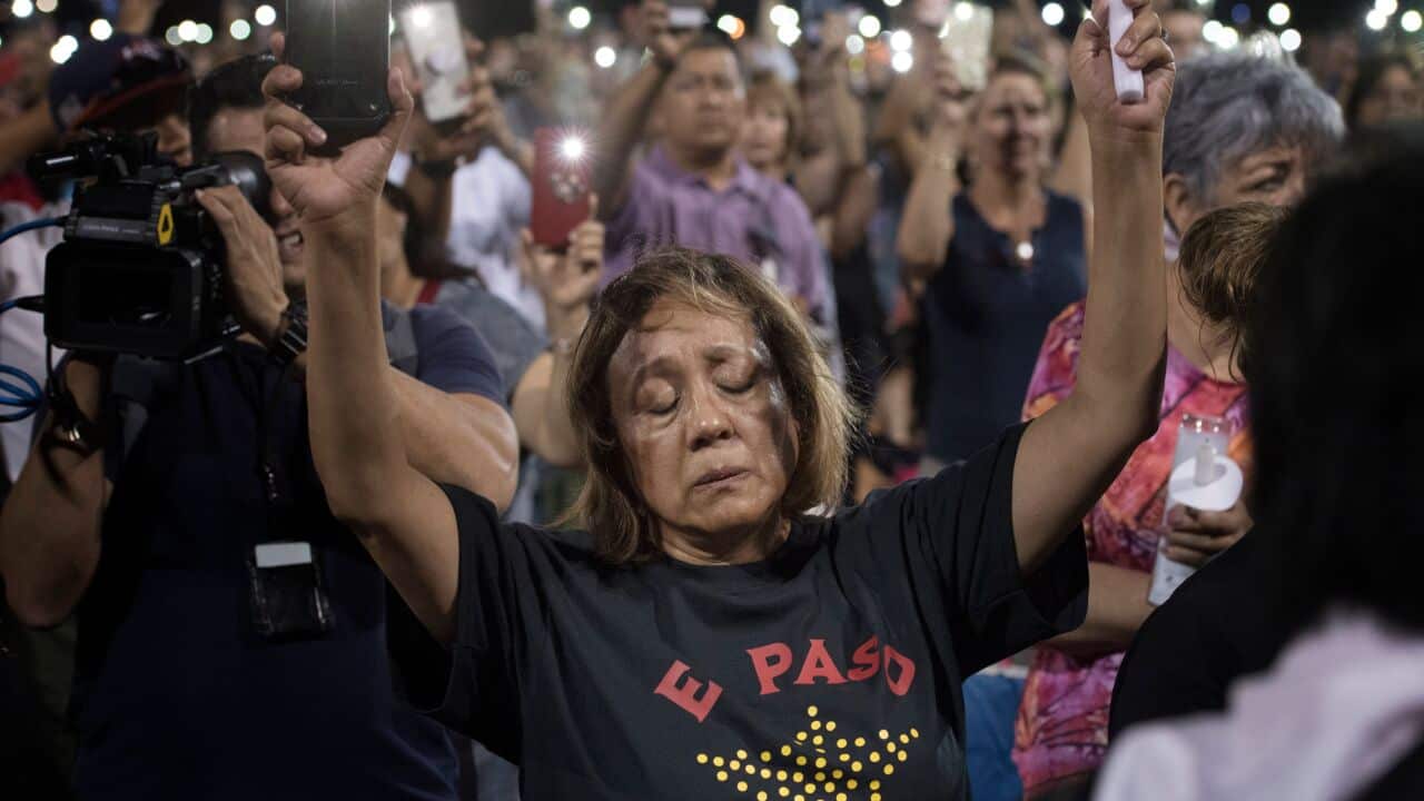 People react during a prayer vigil organized by the city, after a shooting left 20 people dead at the Cielo Vista Mall Wal-Mart in El Paso, Texas, on August 4, 2019. - The United States mourned Sunday for victims of two mass shootings that killed 29 peopl