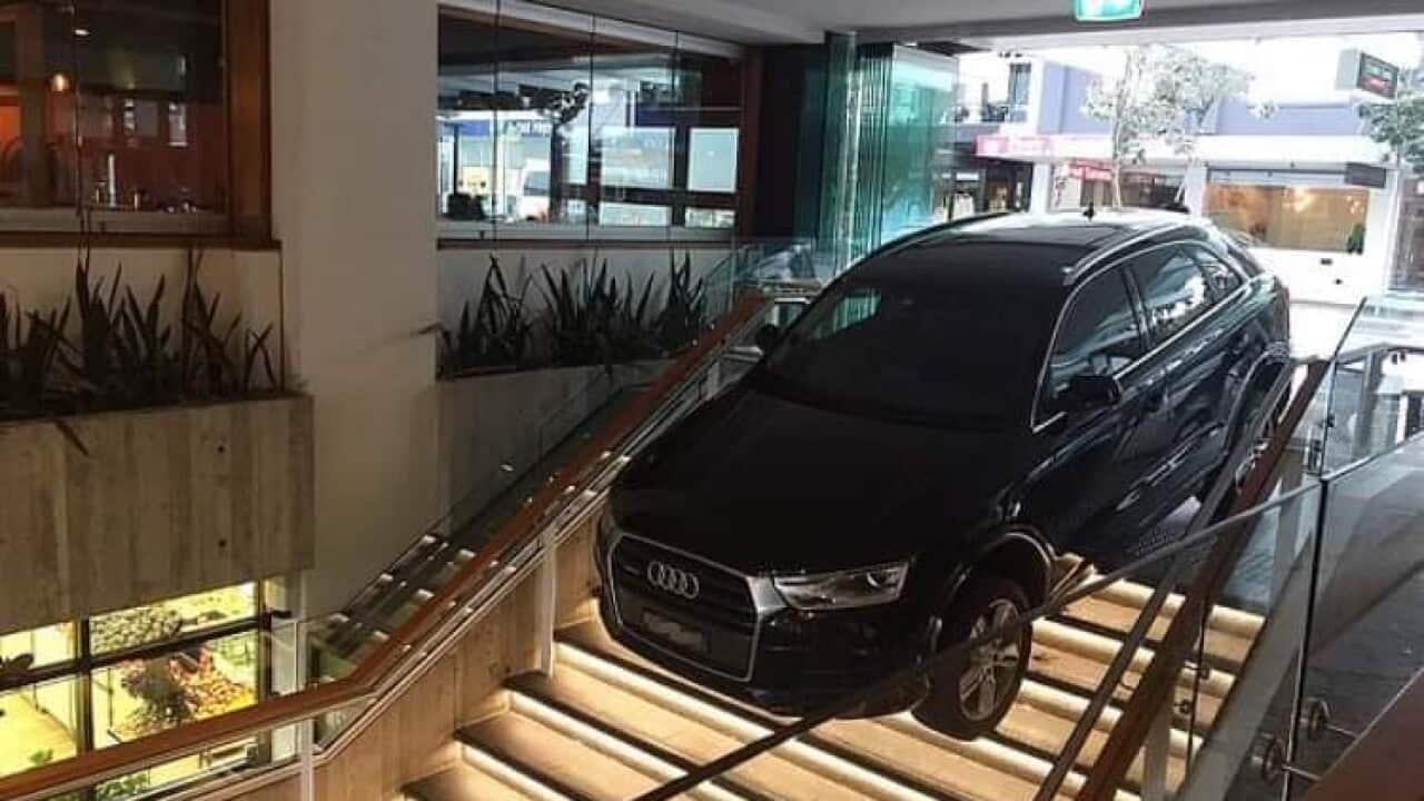 An Uber driver had driven down a set of stairs at Bondi shopping centre.