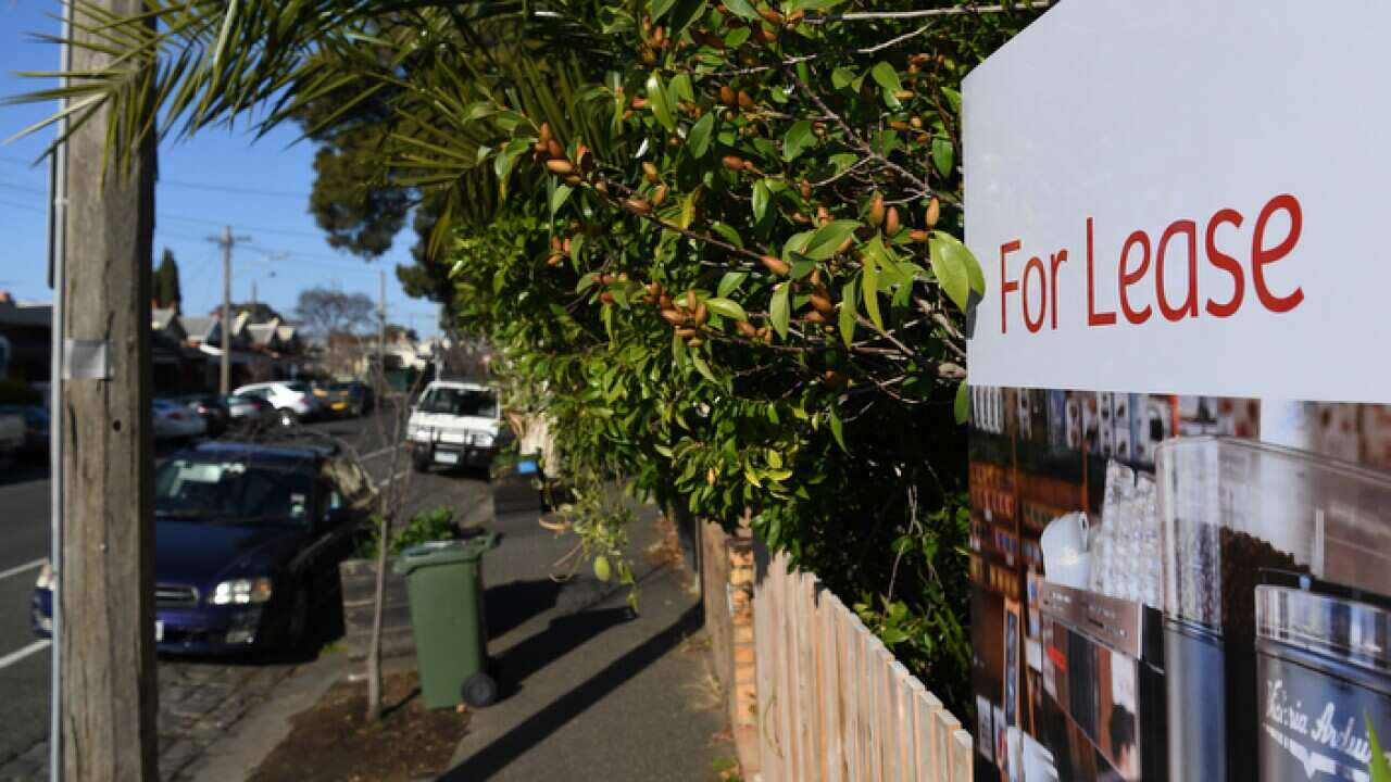 Signage for a real estate property is seen in Carlton North, Melbourne, Wednesday, July 18, 2018. (AAP Image/James Ross) NO ARCHIVING