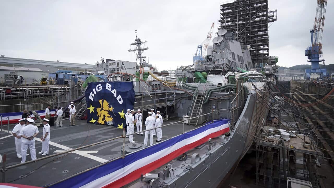 The USS John S. McCain under repair at a dry dock  at the U.S. Naval base in Yokosuka, Japan.