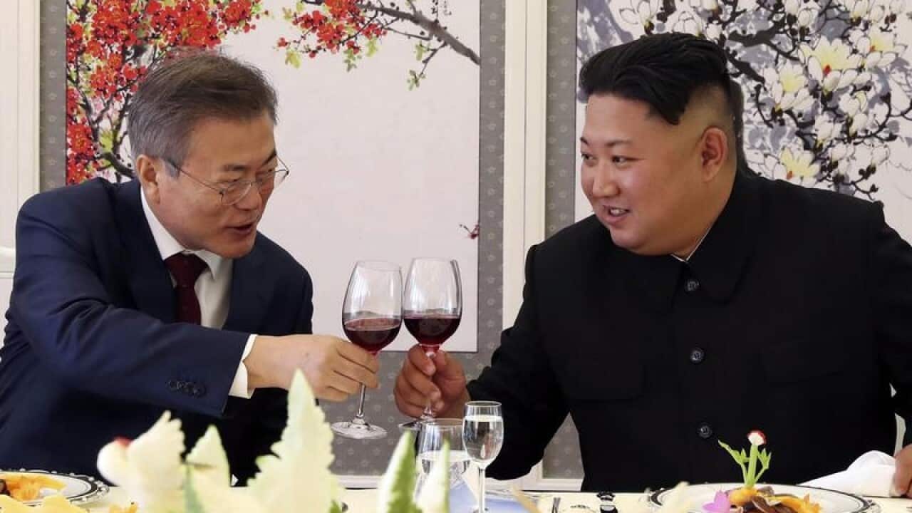 S Korean President Moon Jae-in, left, with North Korea's Kim Jong Un