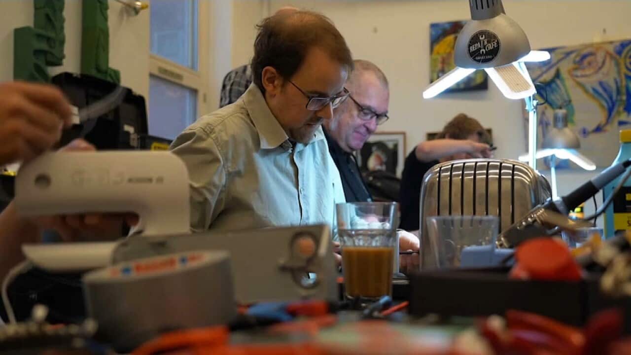 Volunteers repairing equipment at the Copenhagen Repair Cafe