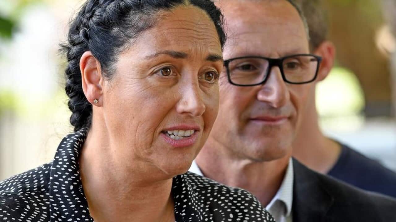 Greens candidate Alex Bhathal speaks beside Richard Di Natalie.