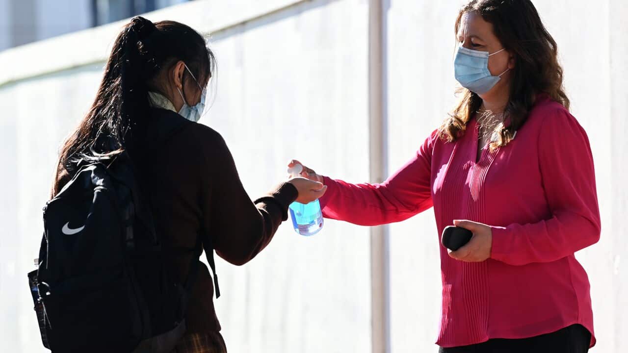 A student applies hand sanitiser in NSW (AAP).