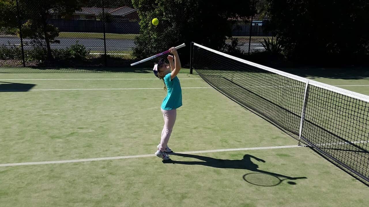 Kid playing tennis