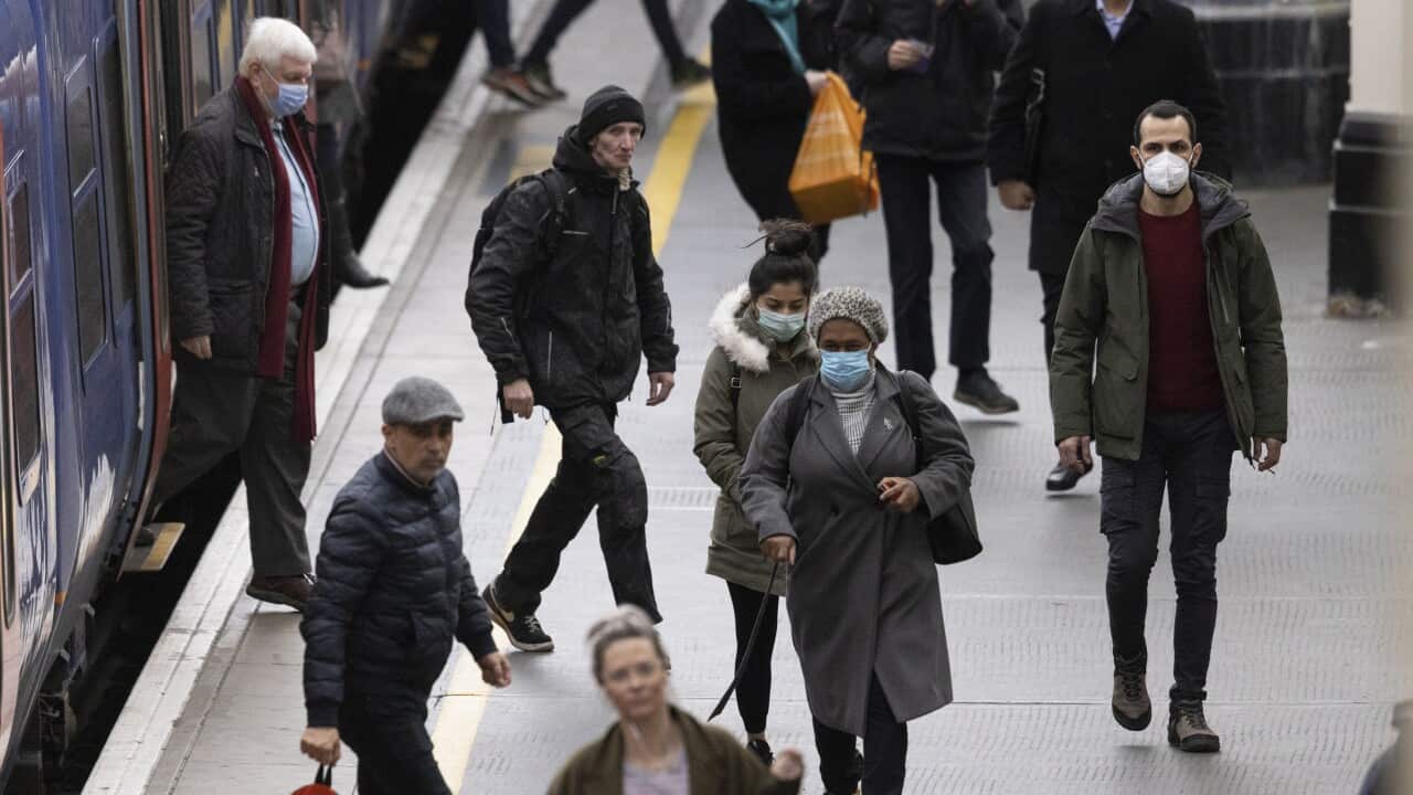 Passengers disembark a train at Waterloo Station on February 21, 2022 in London, England. 