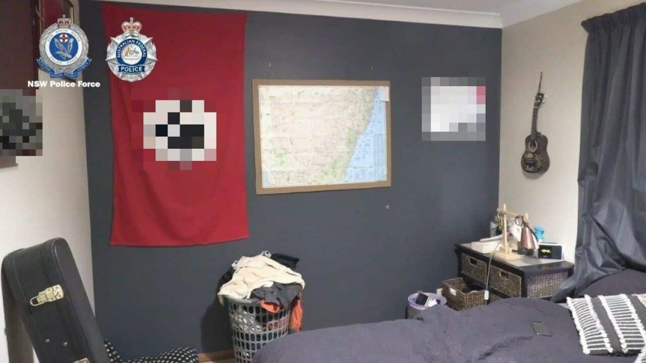 The man's bedroom had a Nazi flag and a NSW map on the walls
