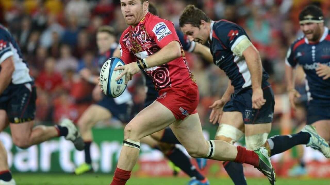Reds player Ben Lucas gets into space during the Super Rugby Match.