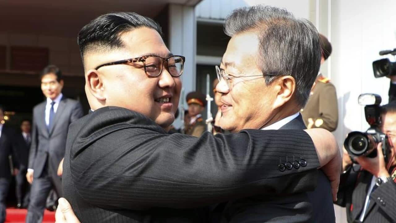 Kim Jong Un and Moon Jae-in embrace at their meeting in the DMZ