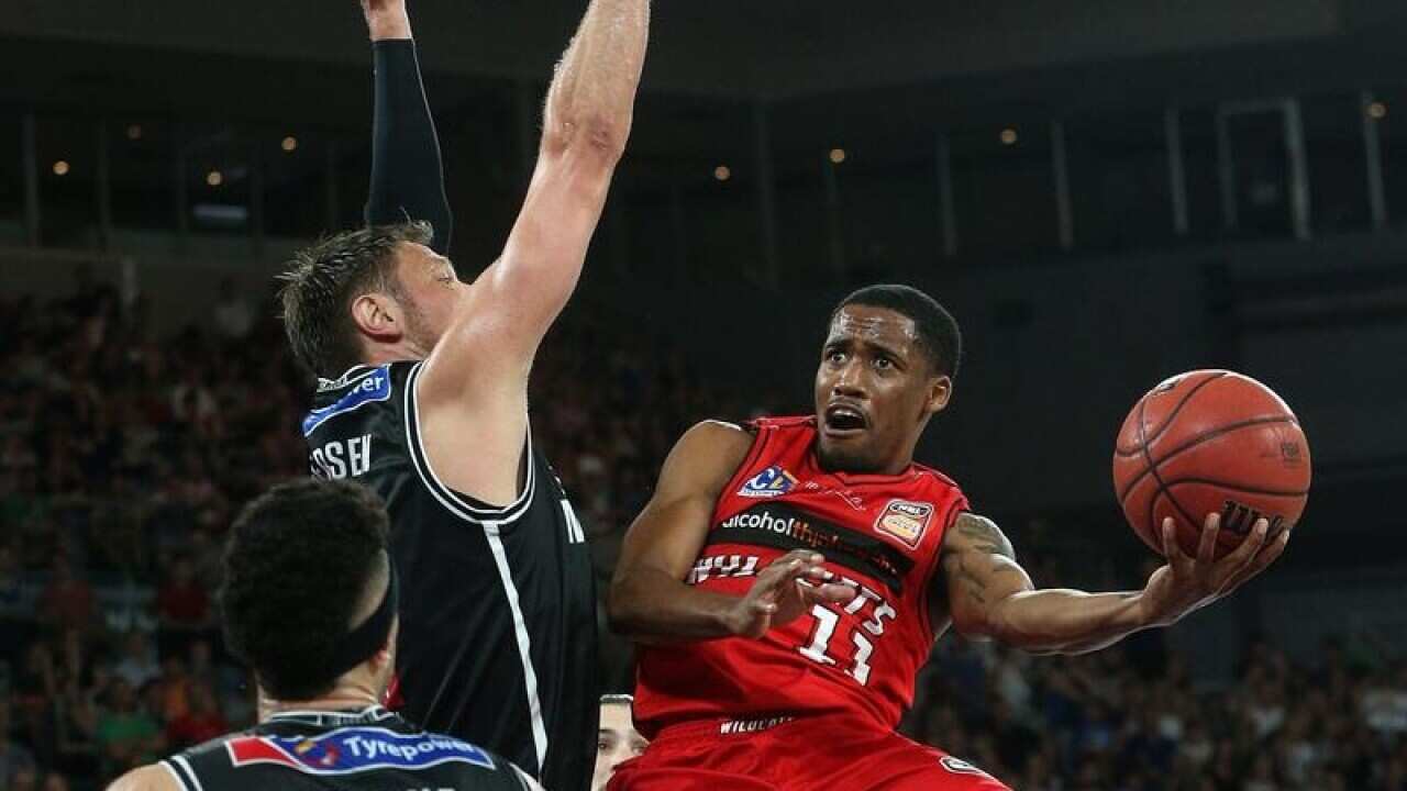 Bryce Cotton of Perth shoots under pressure