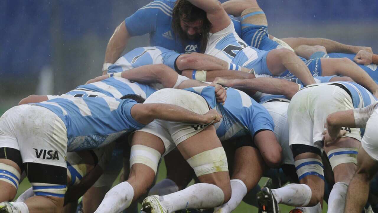 Italy's Martin Castrogiovanni, face to the camera, pushes a scrum