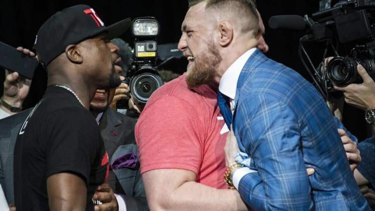 Floyd Mayweather Jr, left, and Conor McGregor