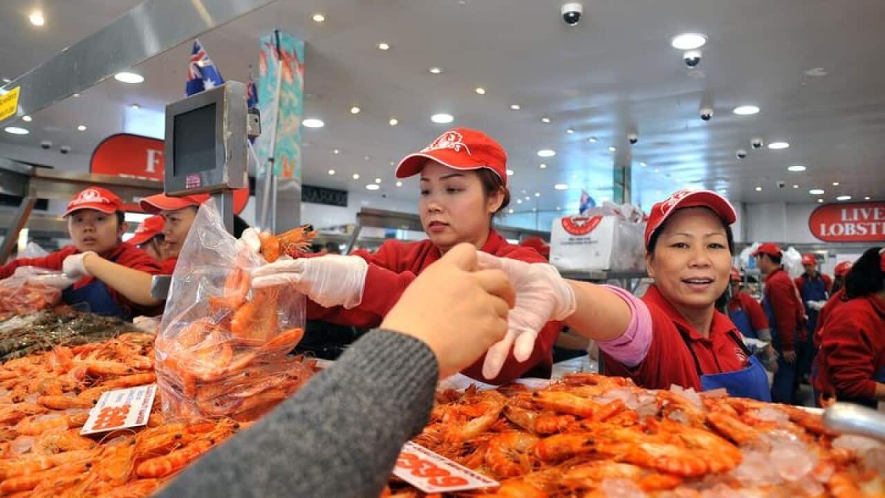 Shoppers buy prawns at the Sydney Fish Market