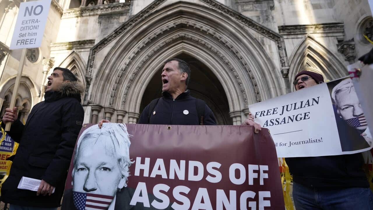 Julian Assange supporters protest in front of the High Court in London.