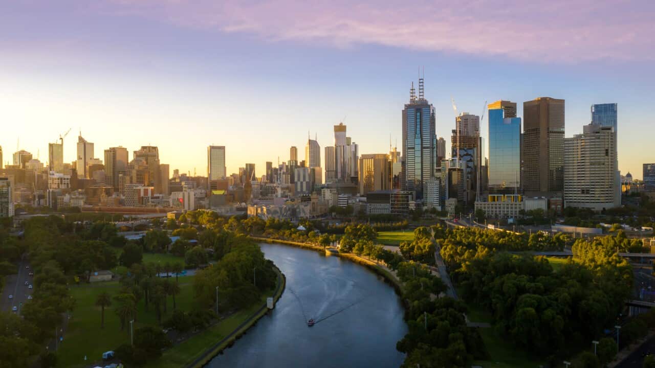 Sunset view of Yarra river and Melbourne skyscrapers business office building with evening skyline in Victoria, Australia. Australia tourism, modern city life, or business finance and economy concept