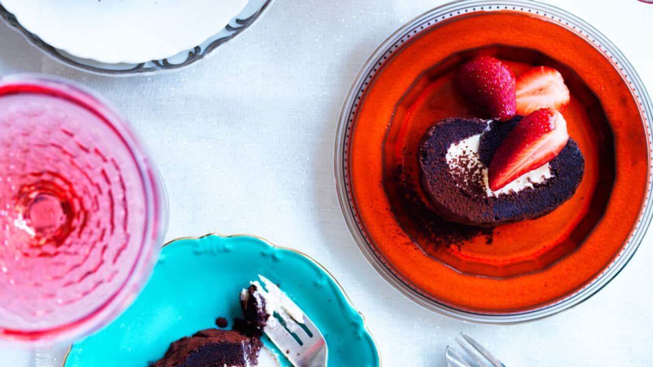 Chocolate roulade with brandy-soaked strawberries and marzipan cream